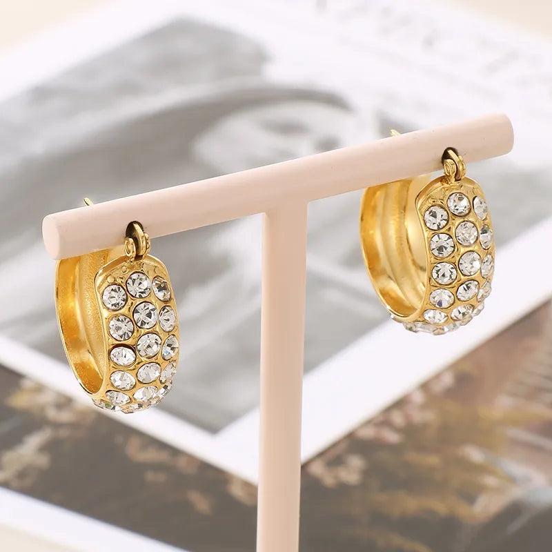 Aretes Huggie Hoops con zirconias | dorado