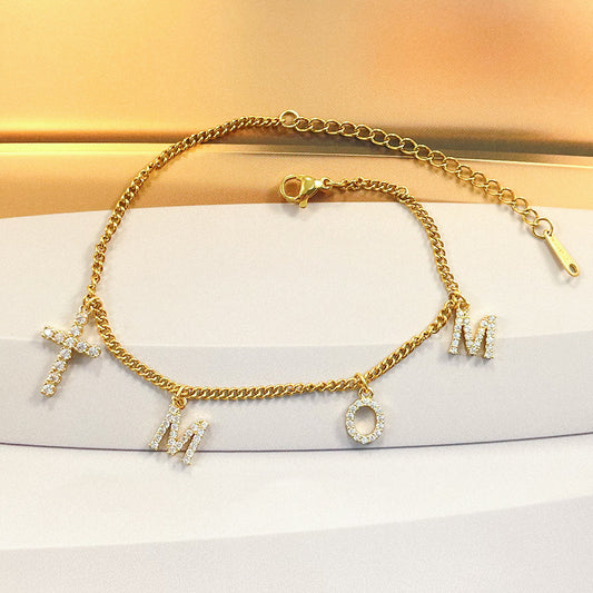 Pulsera mom con zirconias y cruz | dorada