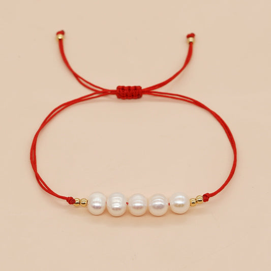 Pulsera de hilo rojo con perlas | ajustable