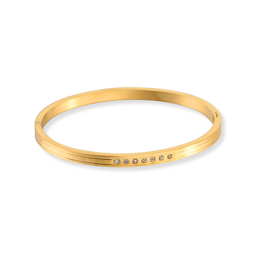 Bangle con zirconias en el centro | dorado