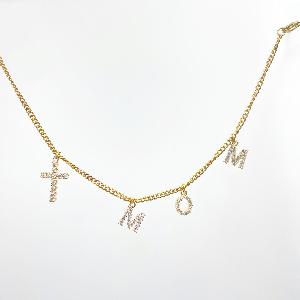 Pulsera mom con zirconias y cruz | dorada